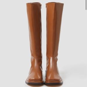 Brown knee high women’s boots.